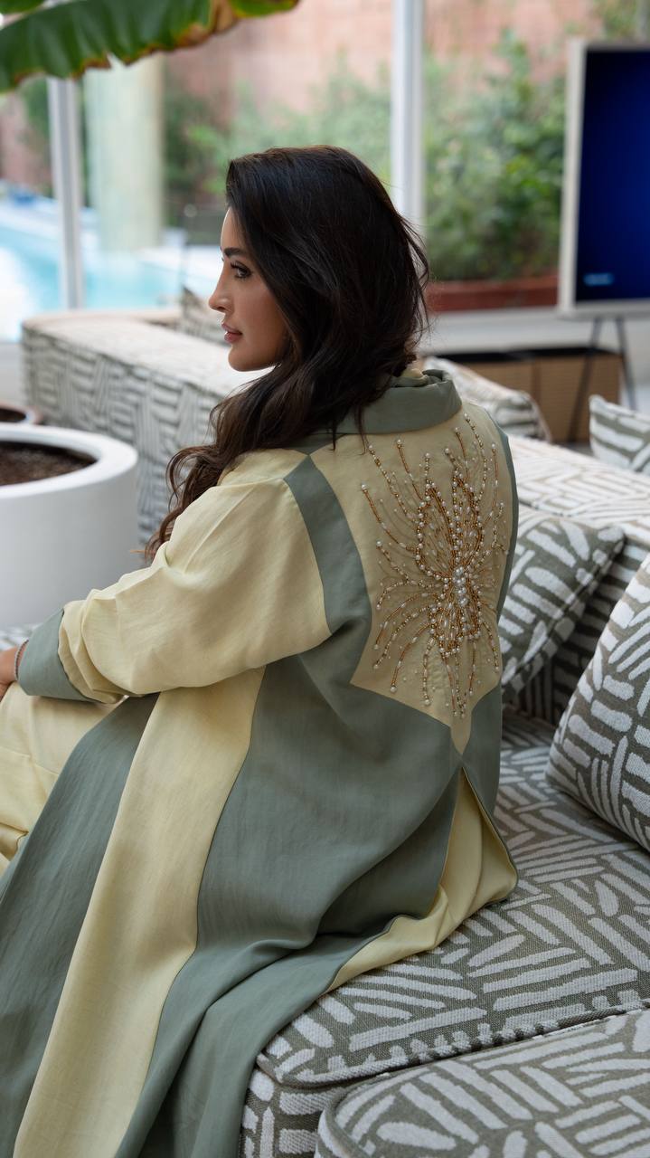 Linen abaya in yellow and pistachio green with hand-stitched details. C:406