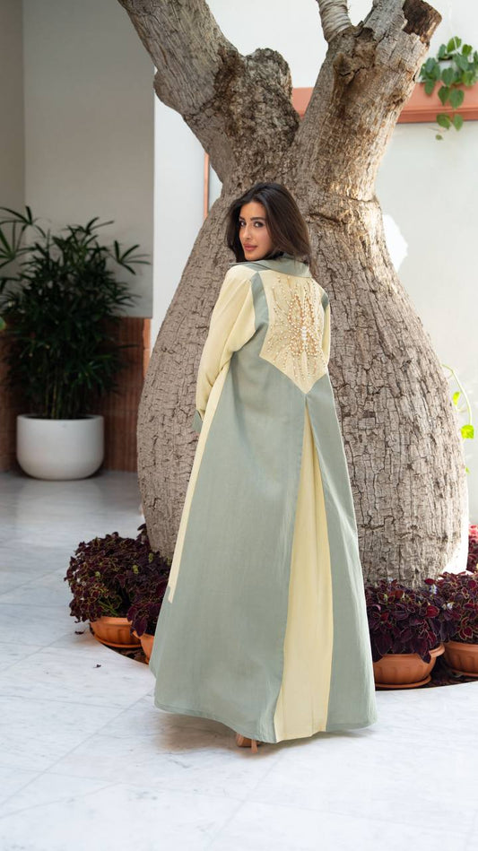 Linen abaya in yellow and pistachio green with hand-stitched details. C:406