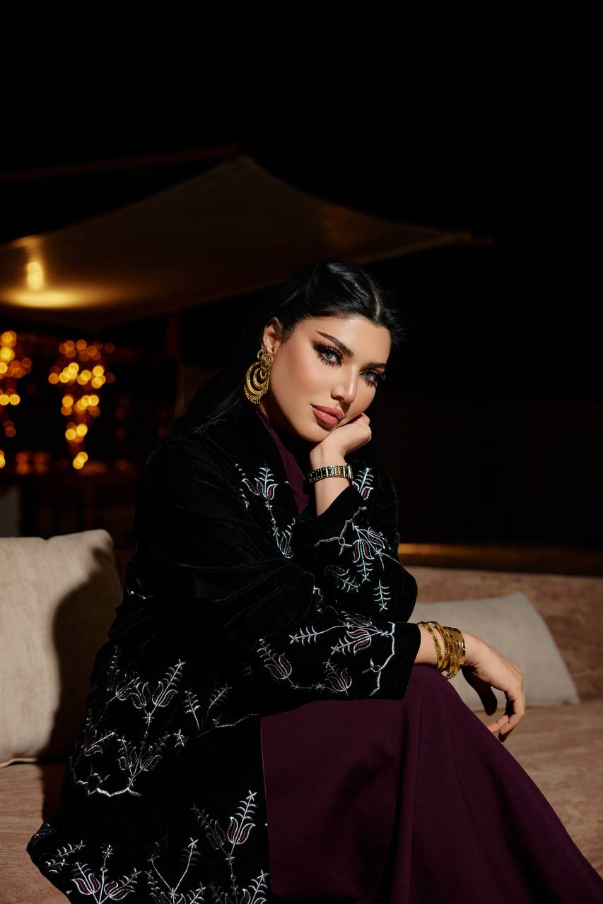 A black velvet abaya set with embroidery, and a burgundy dress.C:380