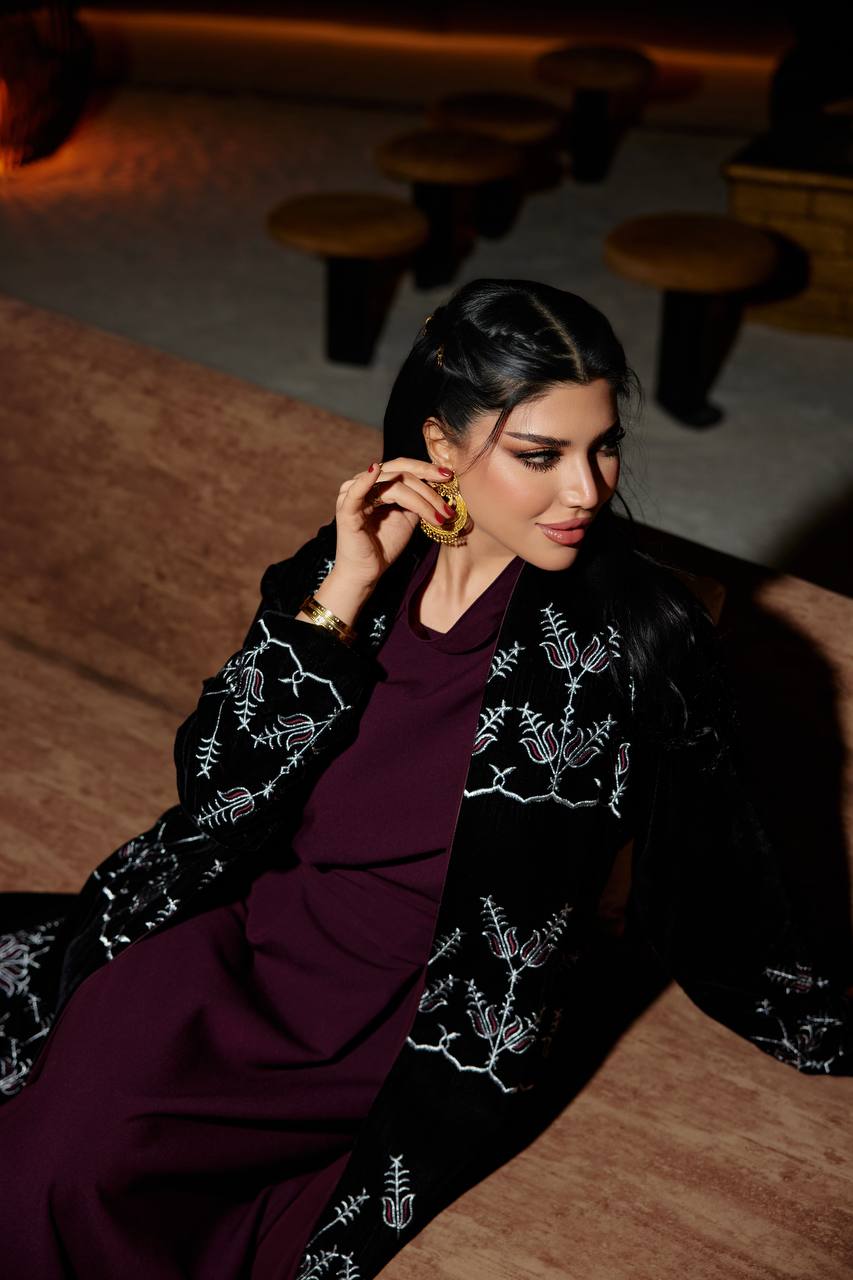 A black velvet abaya set with embroidery, and a burgundy dress.C:380