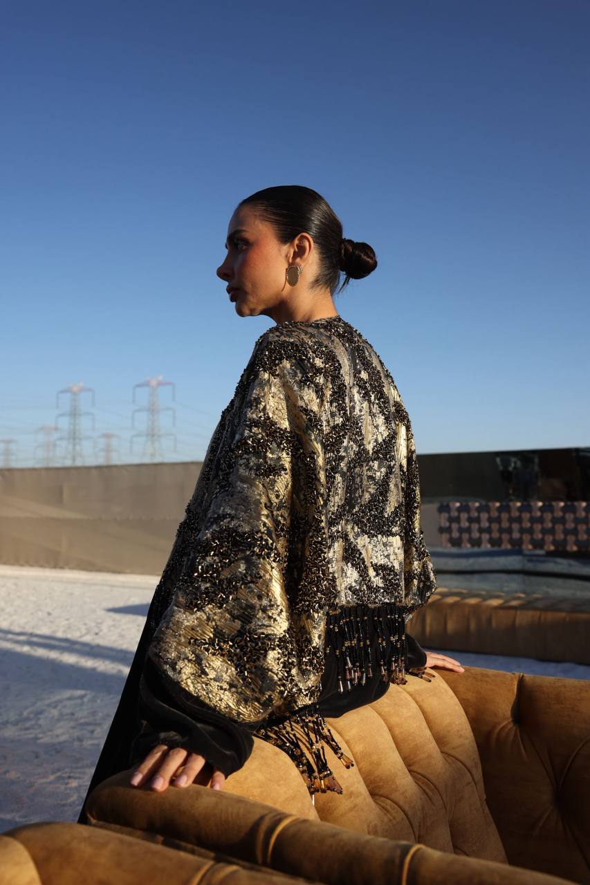 A bisht with a dress, made of jacquard and velvet with hand-stitched details.C:373