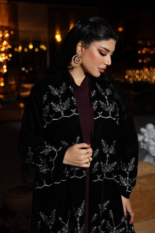 A black velvet abaya set with embroidery, and a burgundy dress.C:380