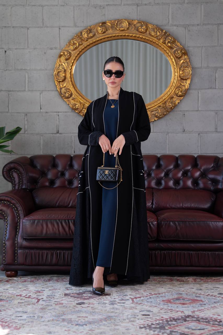 Black crepe abaya with lace trim and beading. C:394