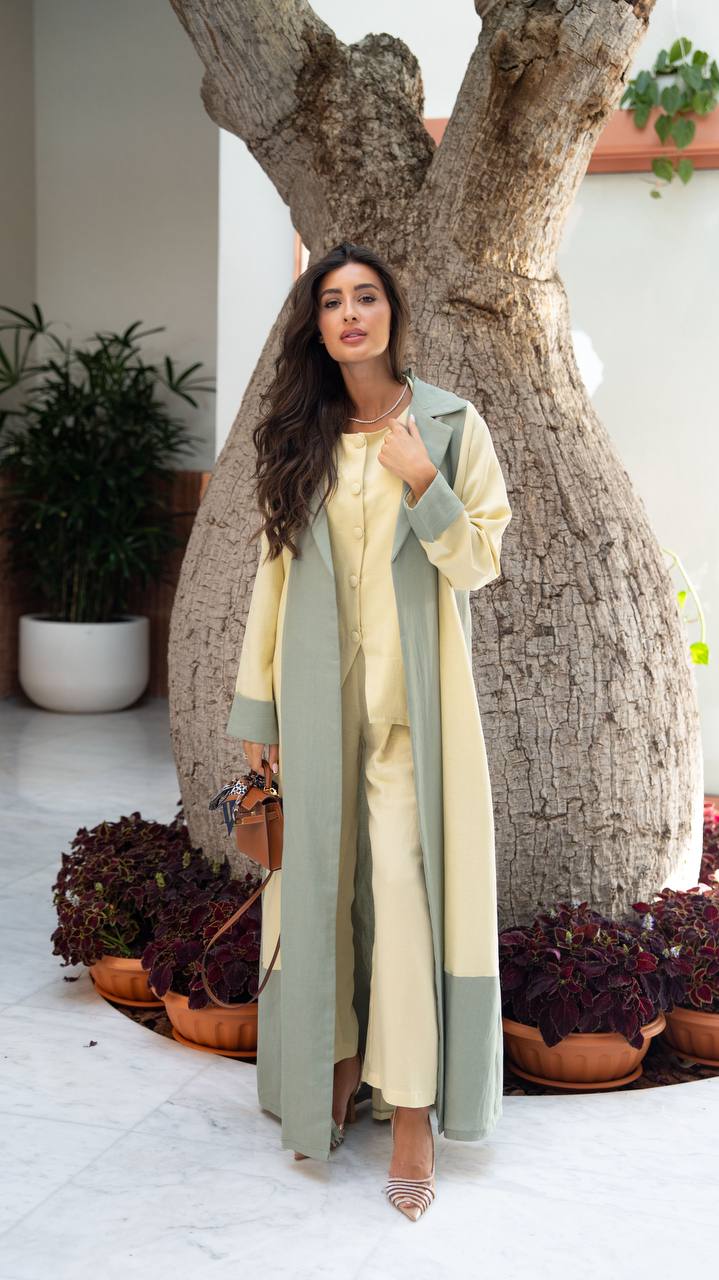Linen abaya in yellow and pistachio green with hand-stitched details. C:406