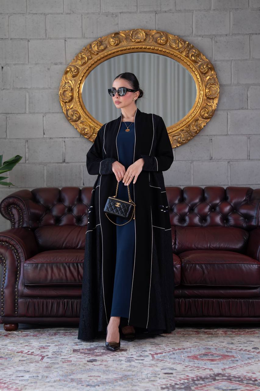 Black crepe abaya with lace trim and beading. C:394