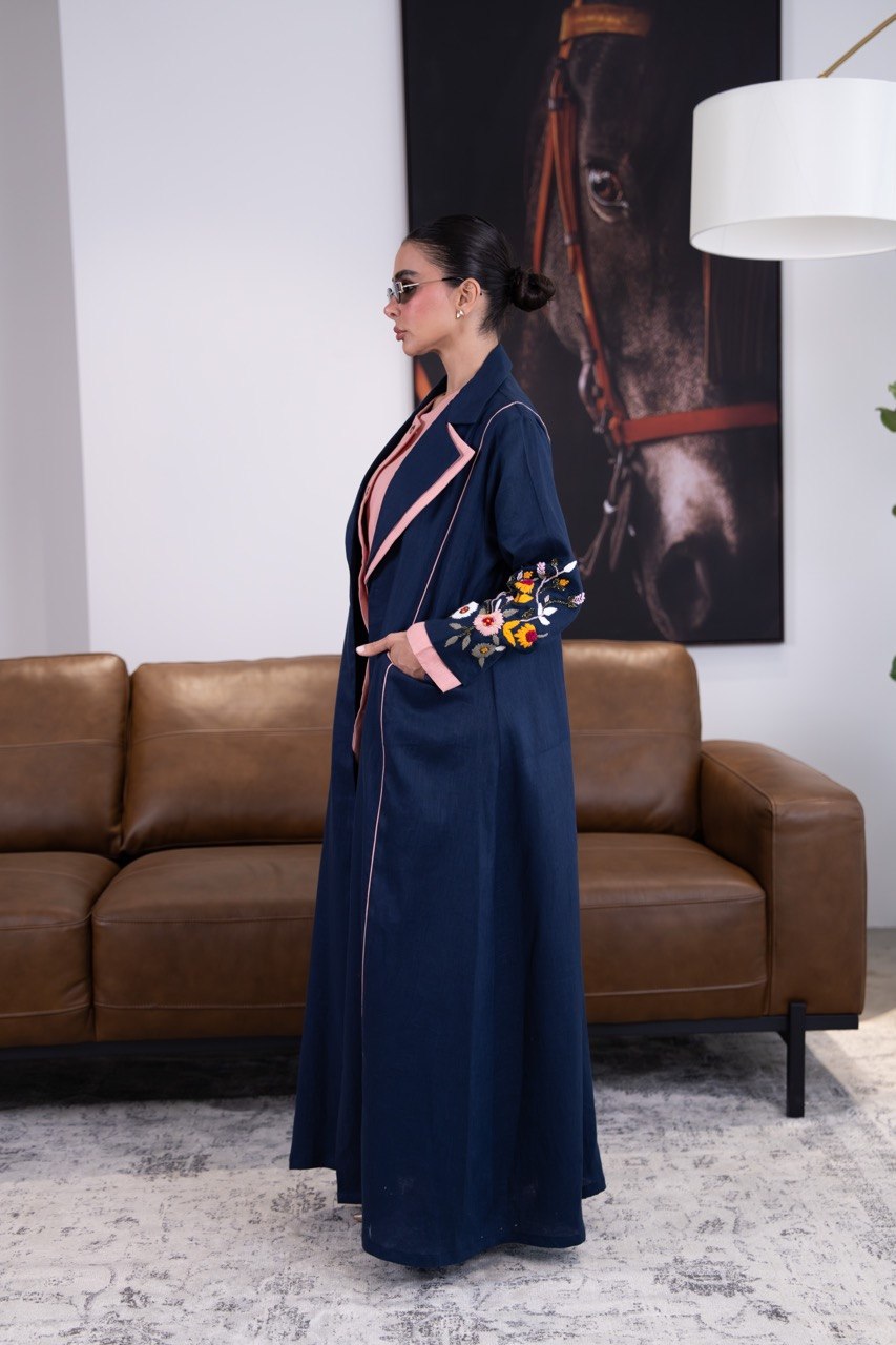 Linen abaya in navy blue with hand-stitched details. C:387