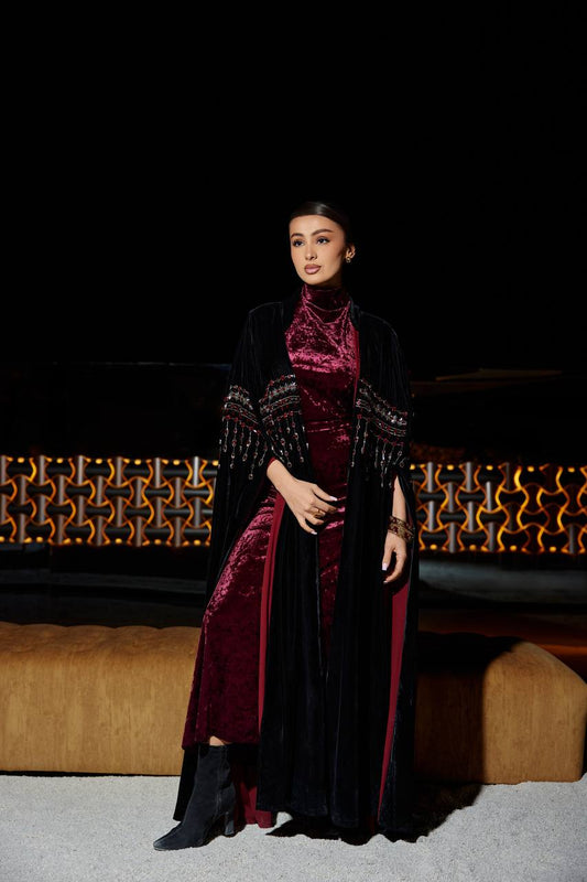 A black velvet bisht set with a burgundy dress.C:379