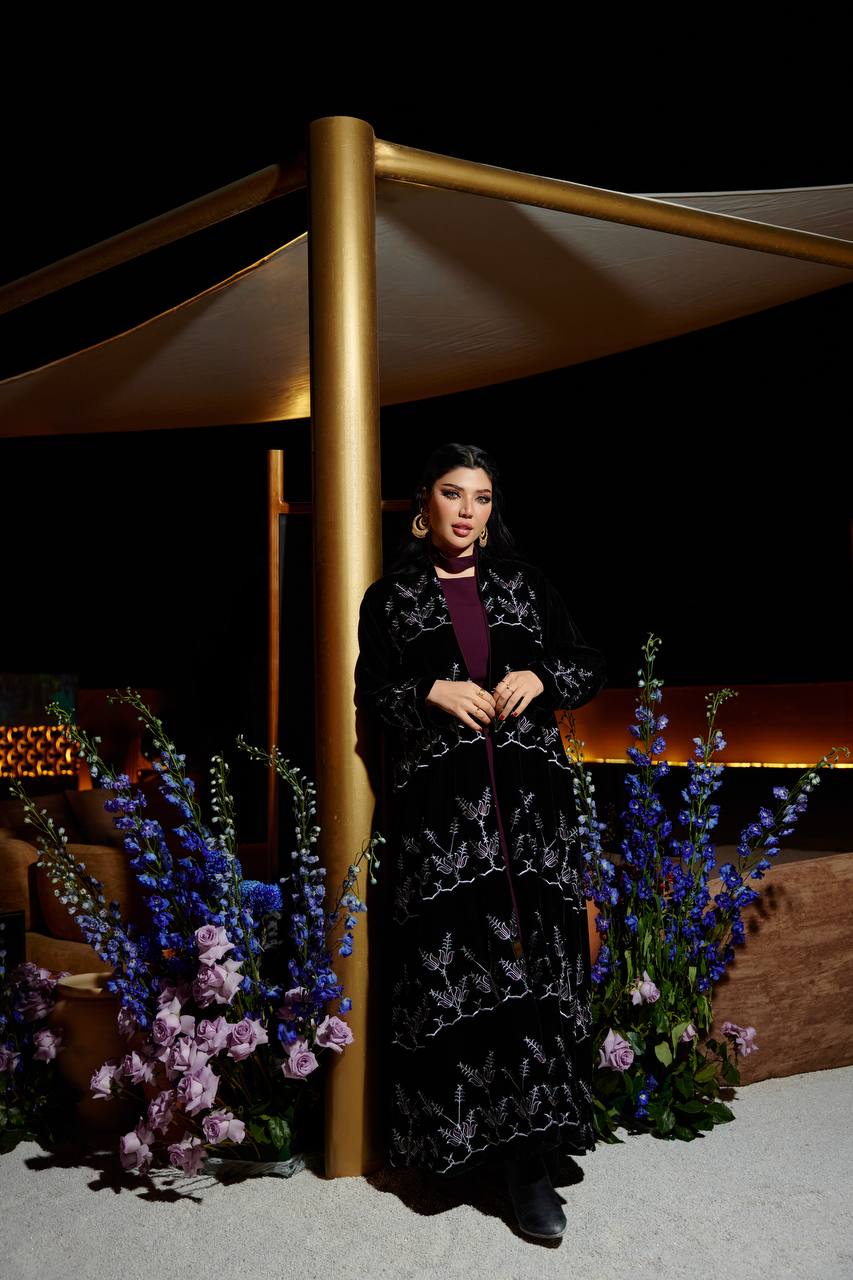 A black velvet abaya set with embroidery, and a burgundy dress.C:380