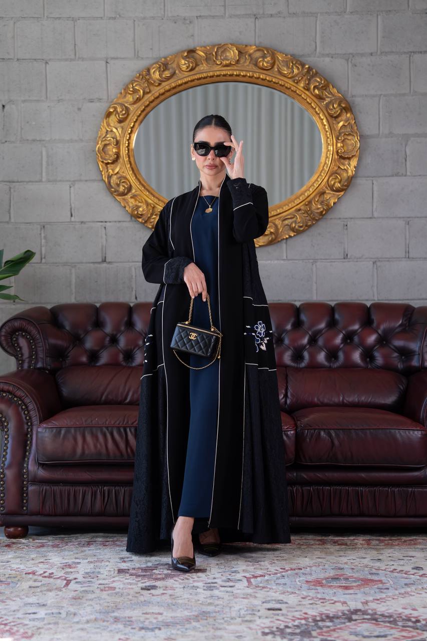 Black crepe abaya with lace trim and beading. C:394