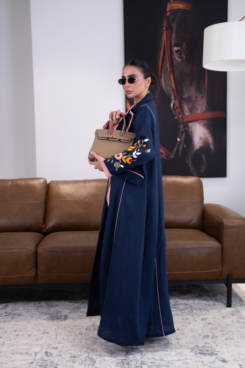 Linen abaya in navy blue with hand-stitched details. C:387