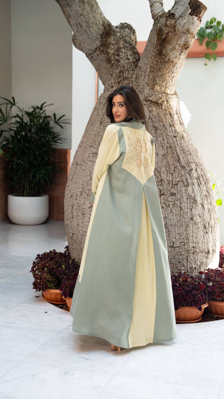 Linen abaya in yellow and pistachio green with hand-stitched details. C:406