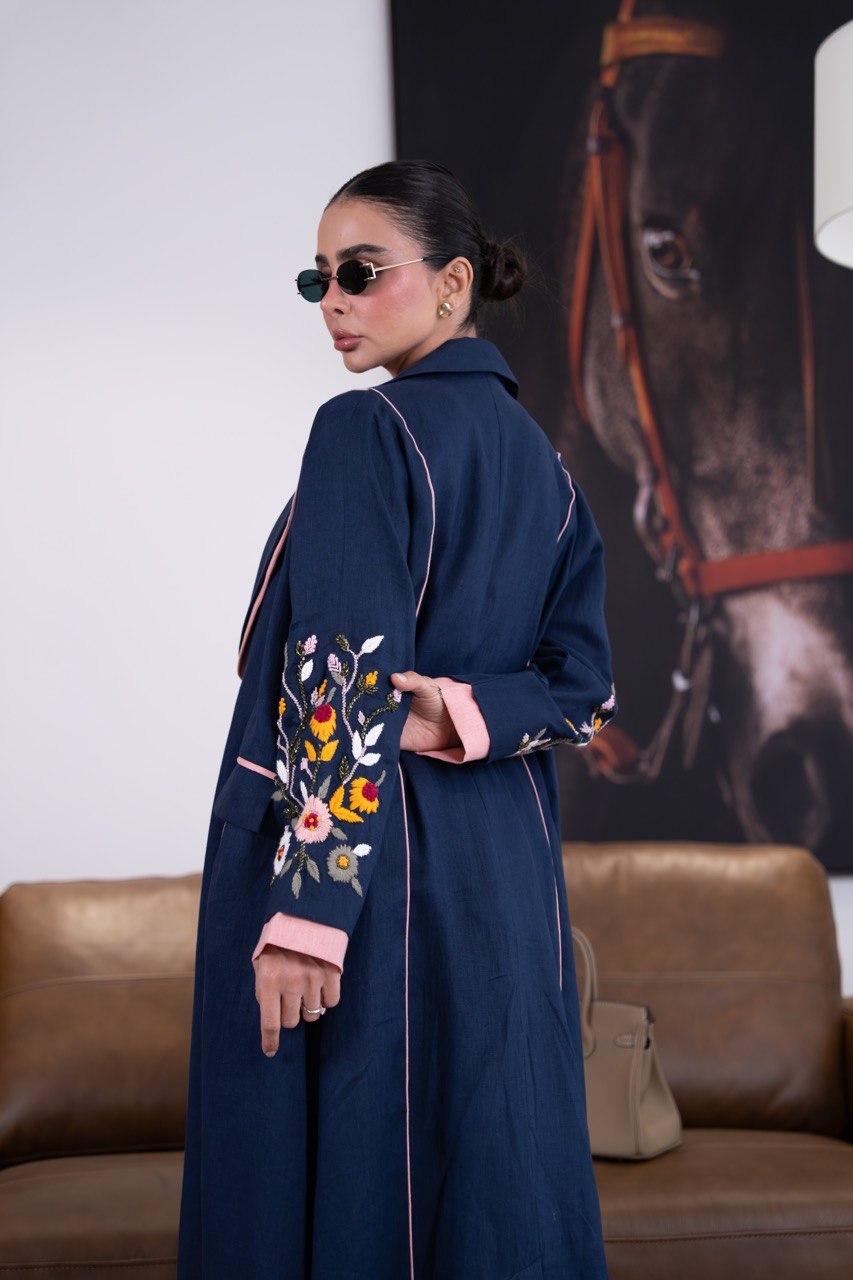 Linen abaya in navy blue with hand-stitched details. C:387