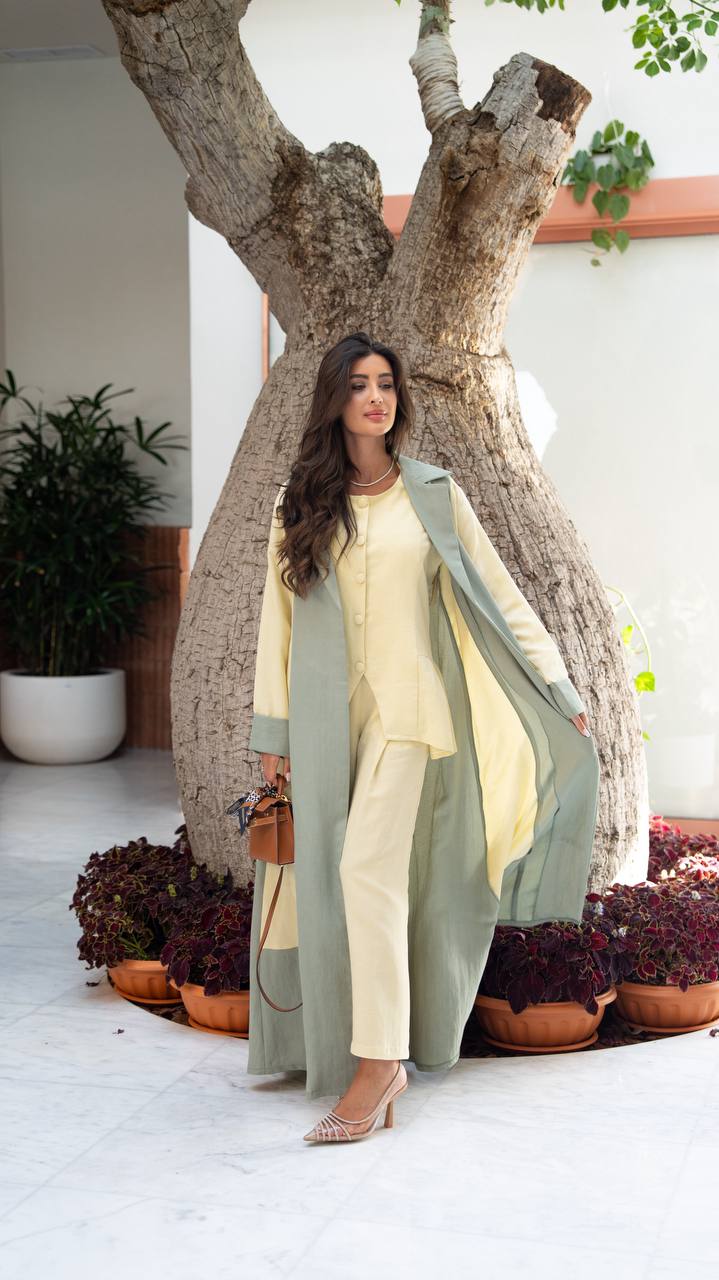 Linen abaya in yellow and pistachio green with hand-stitched details. C:406