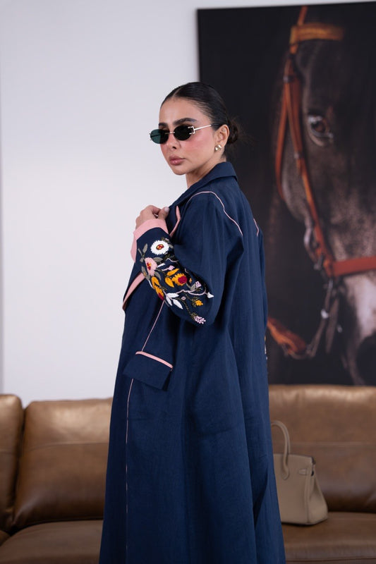Linen abaya in navy blue with hand-stitched details. C:387