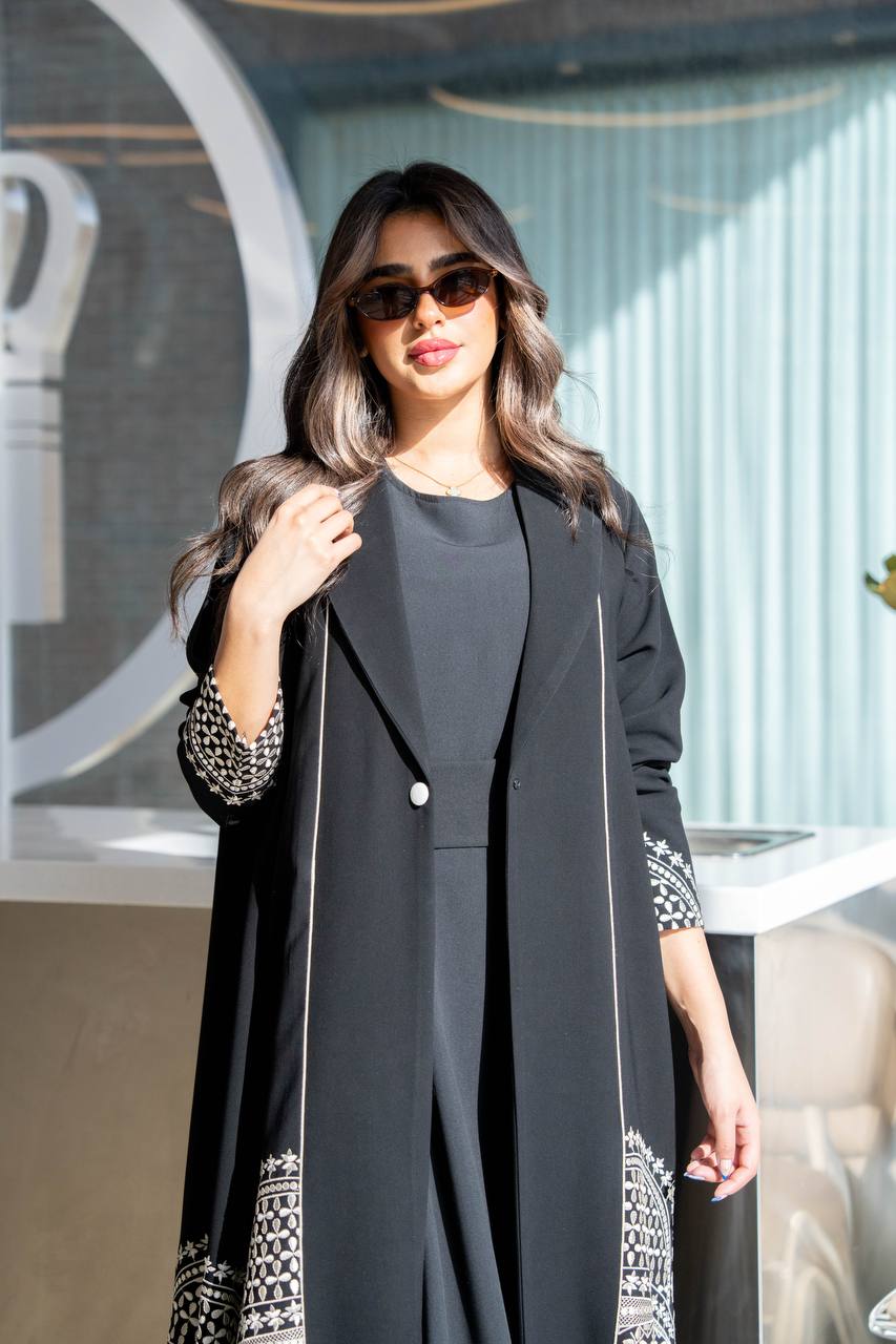 Black crepe abaya with white embroidery. C:384