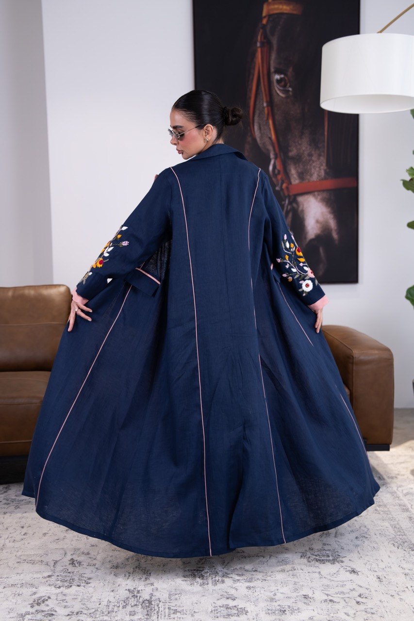 Linen abaya in navy blue with hand-stitched details. C:387