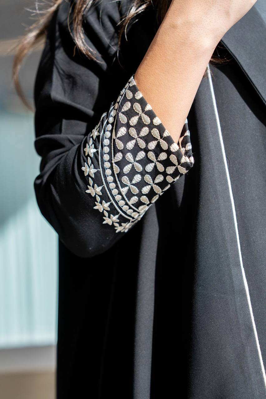 Black crepe abaya with white embroidery. C:384