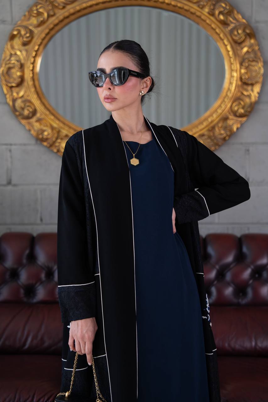 Black crepe abaya with lace trim and beading. C:394