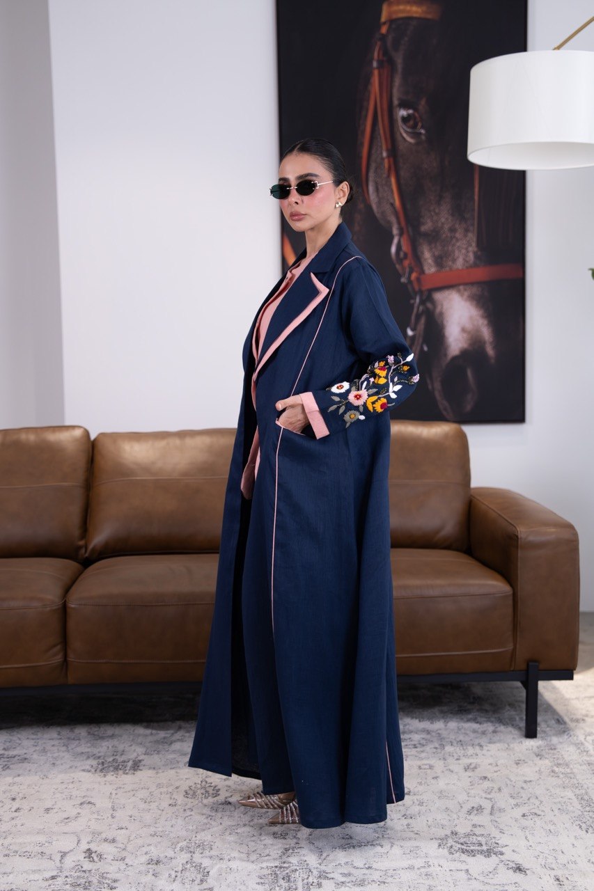 Linen abaya in navy blue with hand-stitched details. C:387